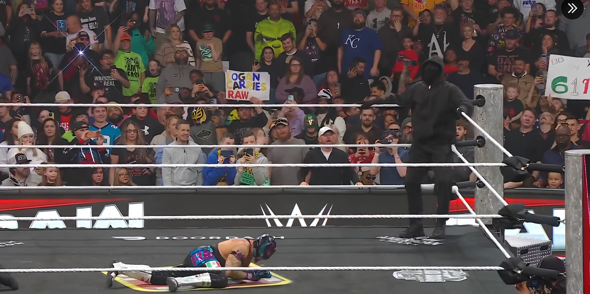 A mystery man attacks Rey Mysterio on WWE RAW (Image source: WWE on YouTube)