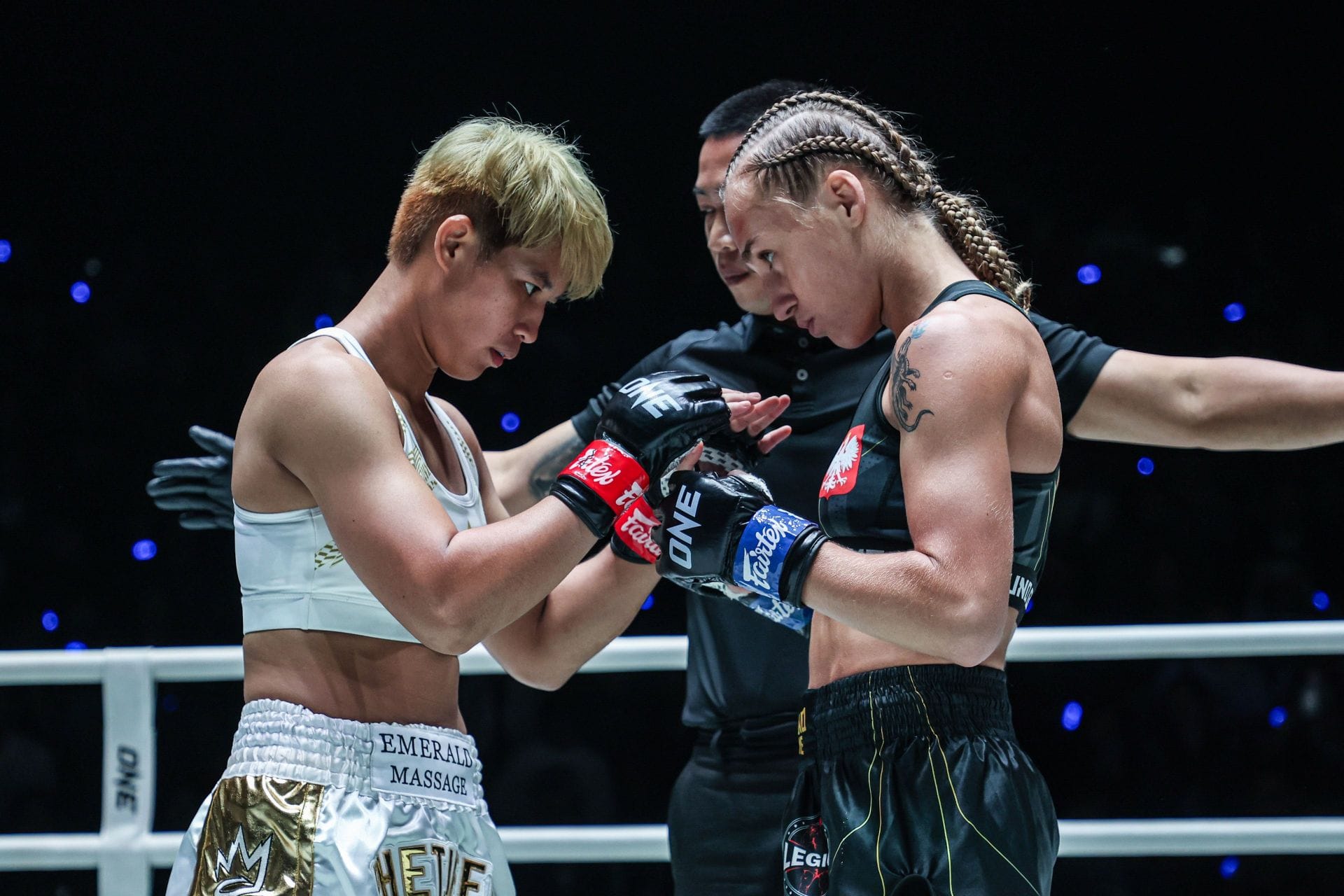 (From left) Phetjeeja and Martyna Dominczak touch gloves before their showdown last Friday. [Image: ONE Championship]