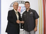 Jim France (L) congratulates Denny Hamlin on the 75 Greatest Drivers list. Source: Getty