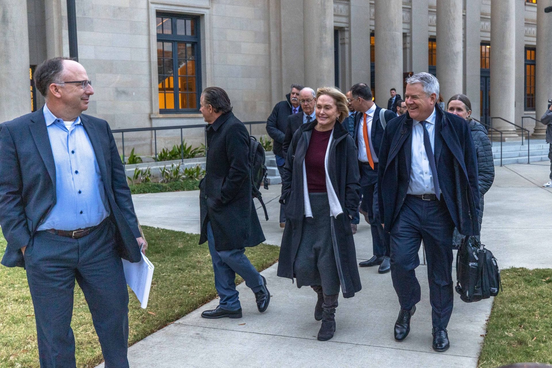 Lesa France (C) and Christopher Yates (R) leave the Charlotte Federal court on December 1, 2025. Source: Getty