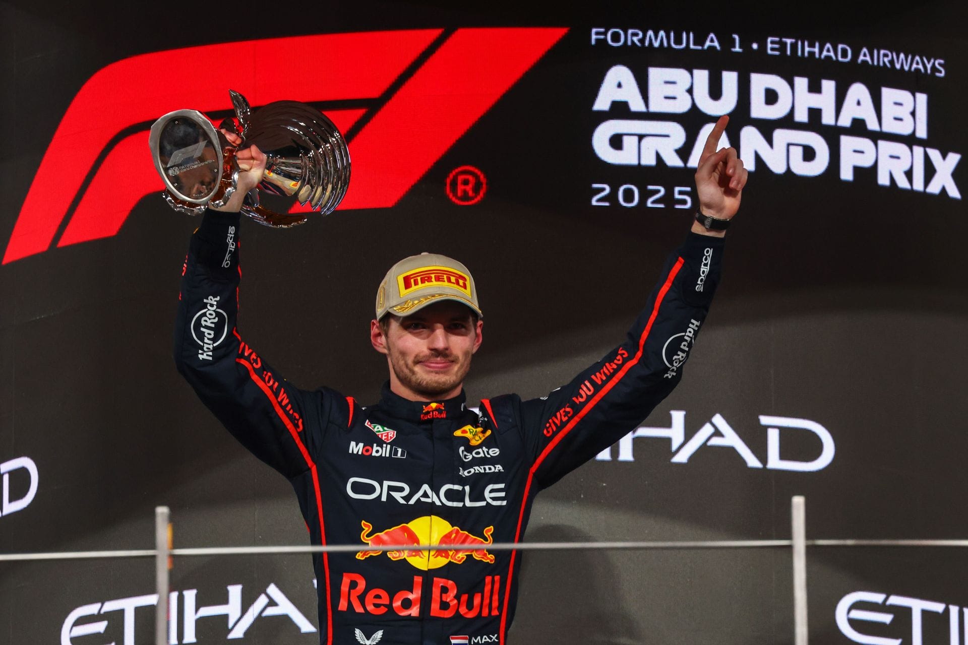 Max Verstappen celebrates with the winner&#039;s trophy at the 2025 F1 Abu Dhabi Grand Prix - Source: Getty