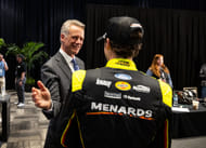 Steve Phelps (L) greets Ryan Blaney during the 2025 Daytona 500. Source: Imagn