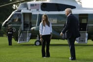 President Donald Trump and his granddaughter, Kai Trump, walk to Marine One (Image via Getty)