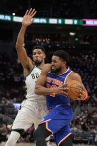 Karl-Anthony Towns #32 of the New York Knicks dribbles the ball against Giannis Antetokounmpo #34 of the Milwaukee Bucks during the third quarter at Fiserv Forum on October 28, 2025 in Milwaukee, Wisconsin - Source: Getty