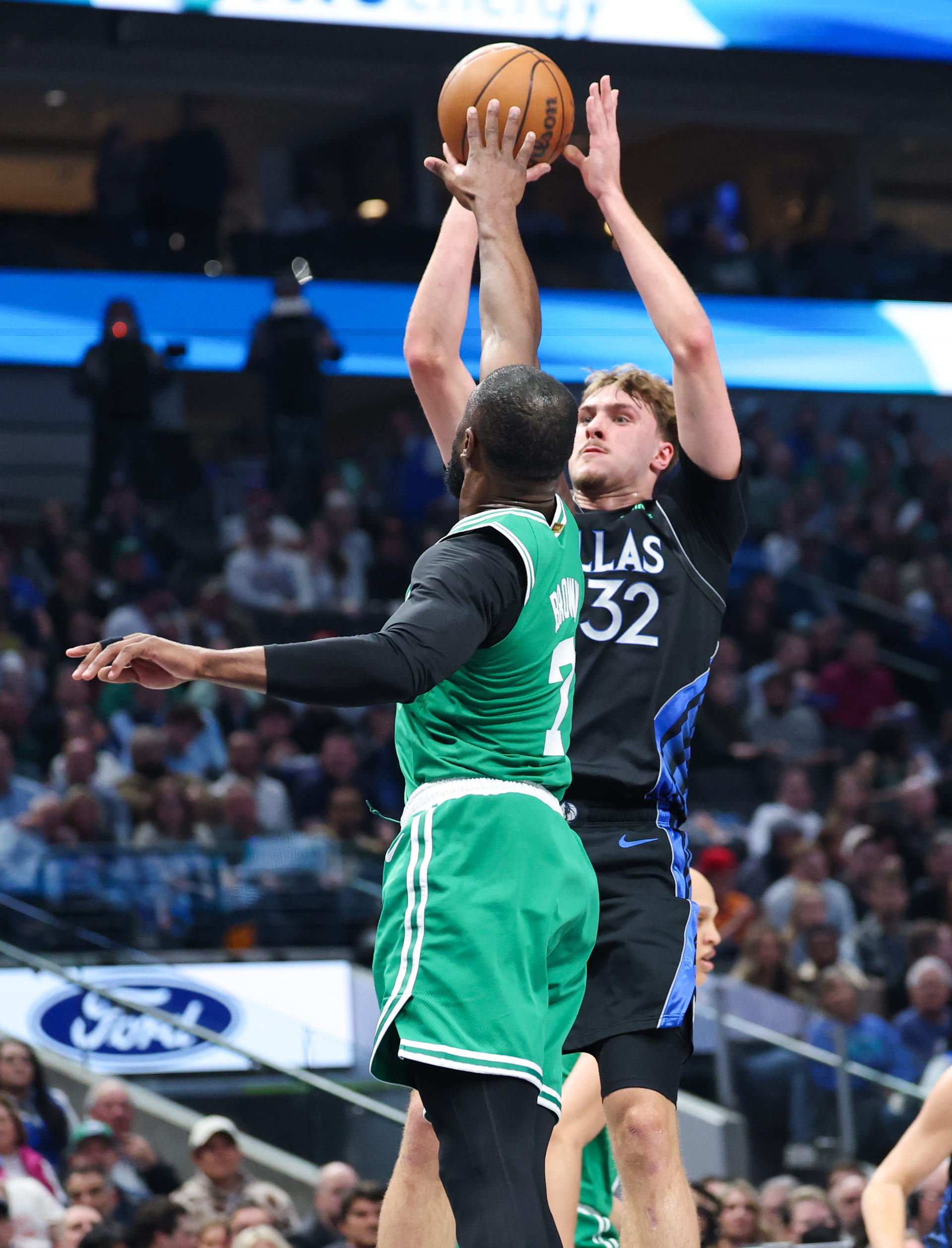 Dallas Mavericks forward Cooper Flagg (32) shoots as Boston Celtics guard Jaylen Brown (7) defends - Source: Imagn
