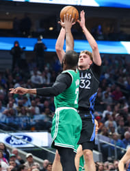 Dallas Mavericks forward Cooper Flagg (32) shoots as Boston Celtics guard Jaylen Brown (7) defends - Source: Imagn