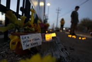 : Candles are placed at a makeshift memorial for Nancy Guthrie in front of the KVOA television station on March 01, 2026 in Tucson, Arizona (Image via Getty)