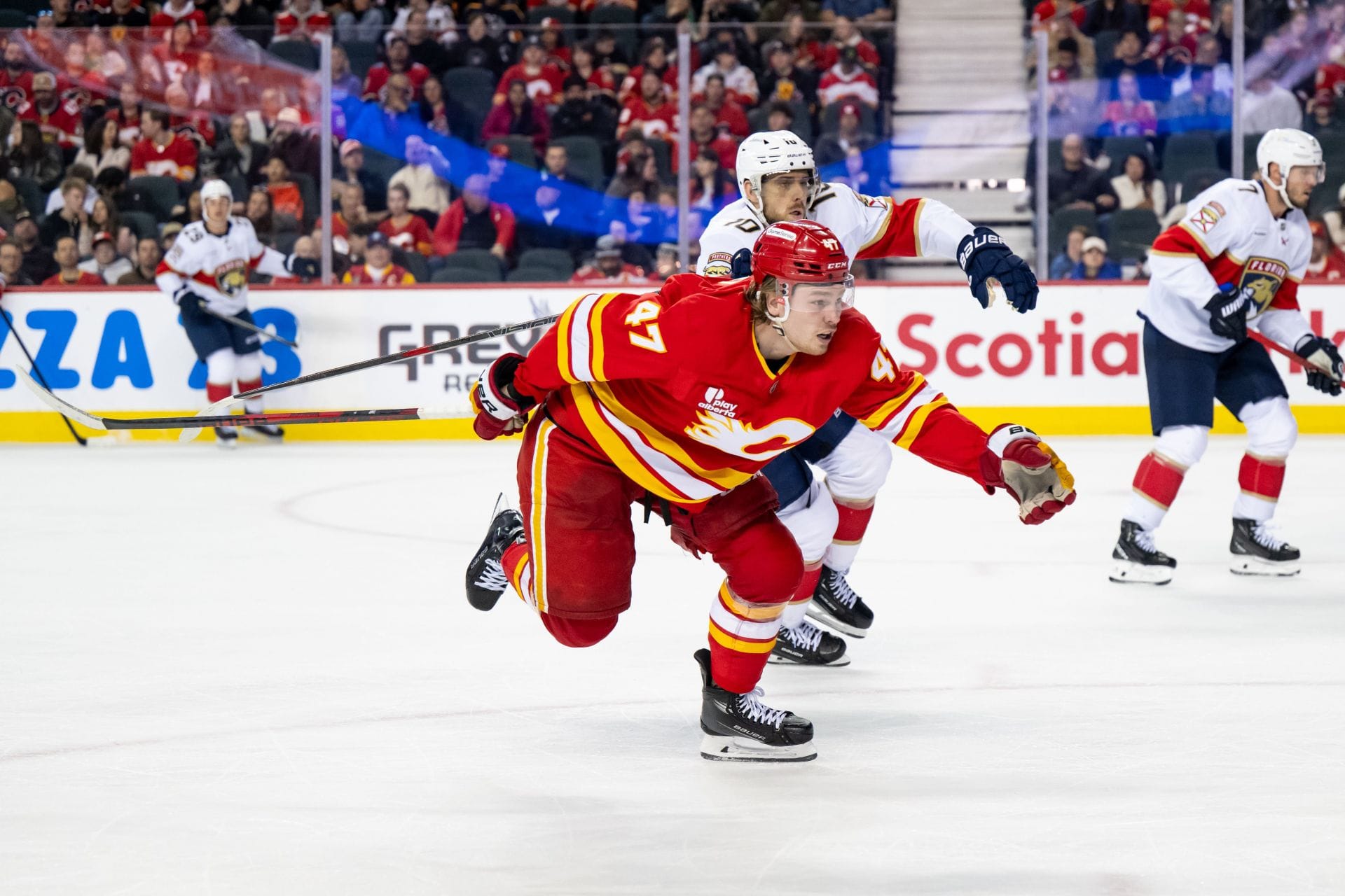 "5+ games. No need for that BS": Fans react as A.J. Greer's hit from behind sends Connor Zary crashing into boards