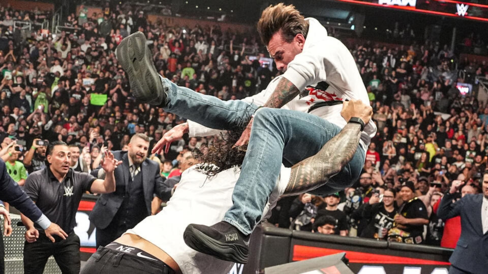 TKO Group reacts after Roman Reigns ambushes CM Punk on WWE RAW and puts him through a table