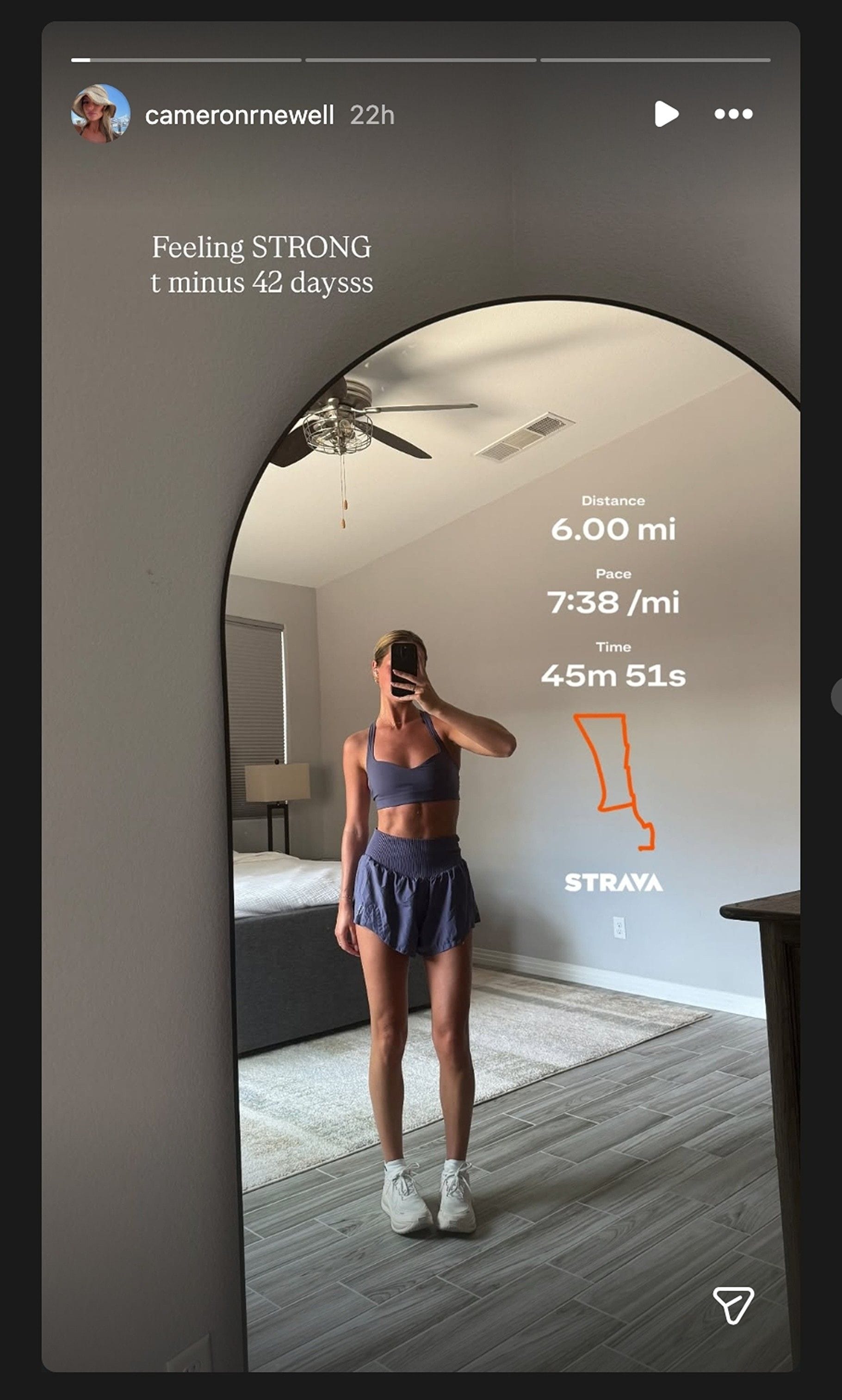 Brock Bowers' GF Cameron poses for chic mirror selfie in blue workout skirt while flaunting perfectly toned abs/@cameronrnewell