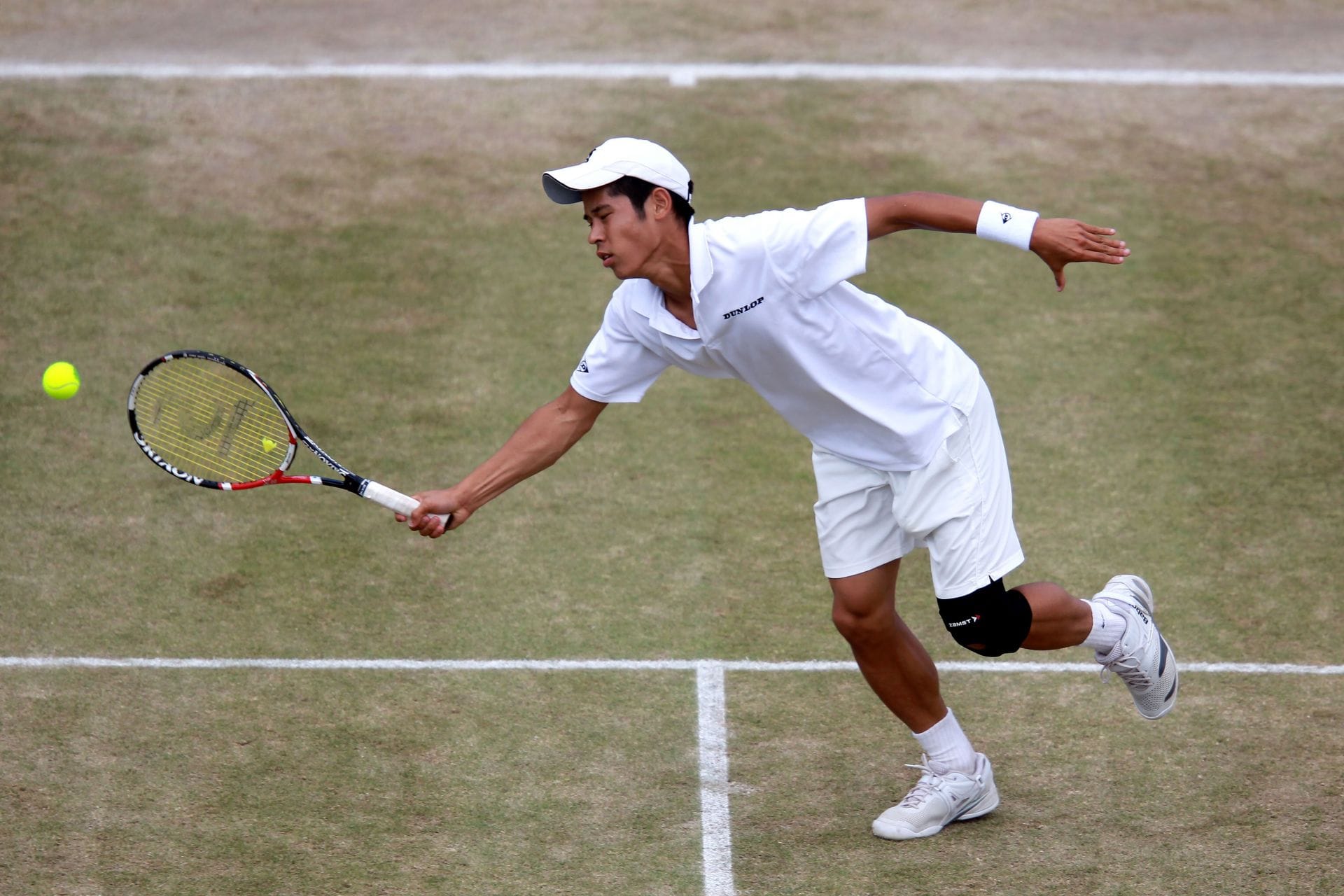 Kaichi Uchida do Japão durante o All England Lawn Tennis and Croquet Club 2011 em Londres, Inglaterra. (Foto de Getty Images)