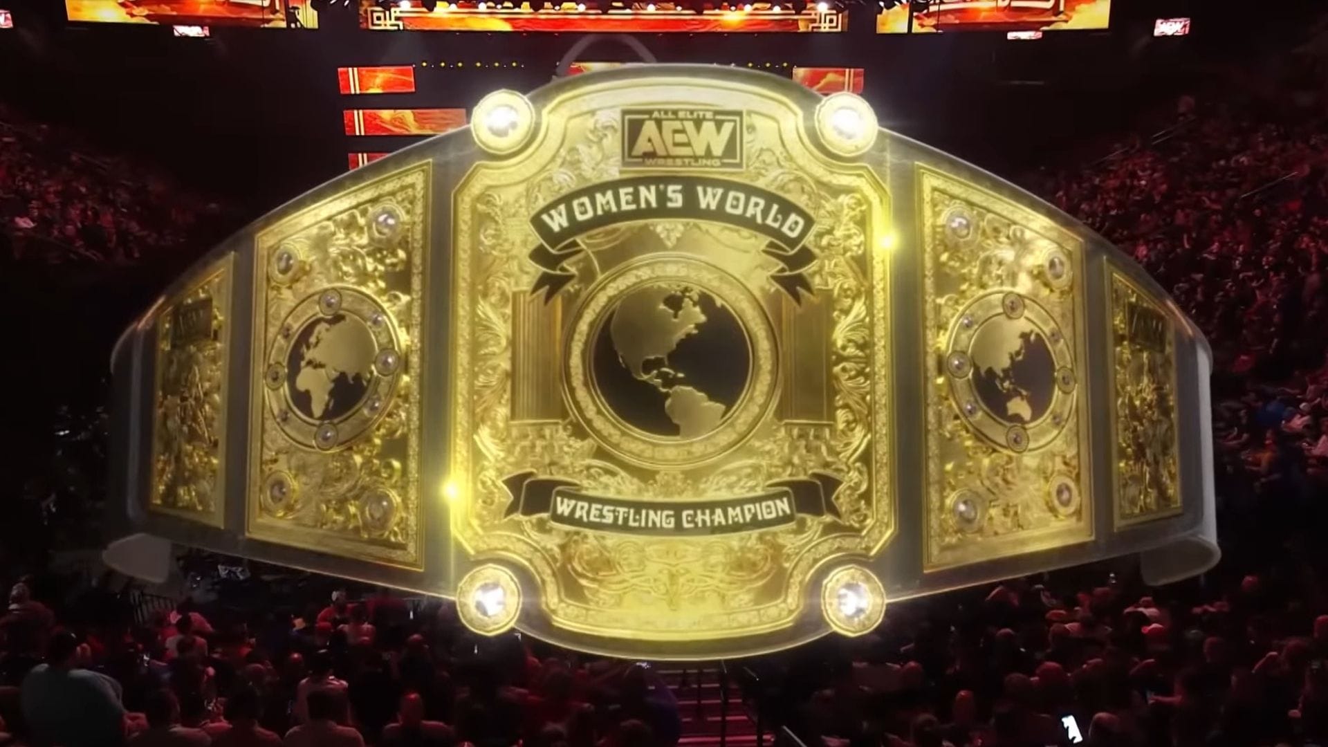 Current AEW Champion restrained by staff and forcibly ejected after invading another wrestling promotion