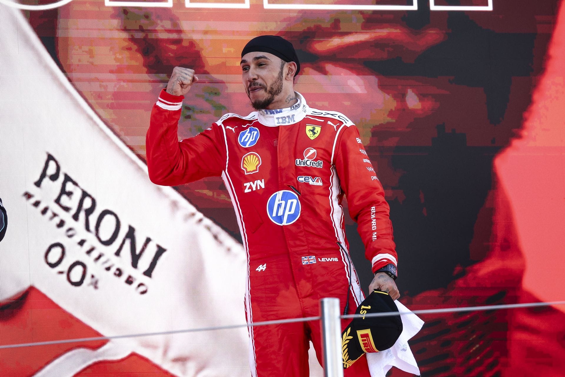 Jeremy Clarkson takes a sneaky dig at Lewis Hamilton as the driver leads the first 'All-British' podium in 58 years