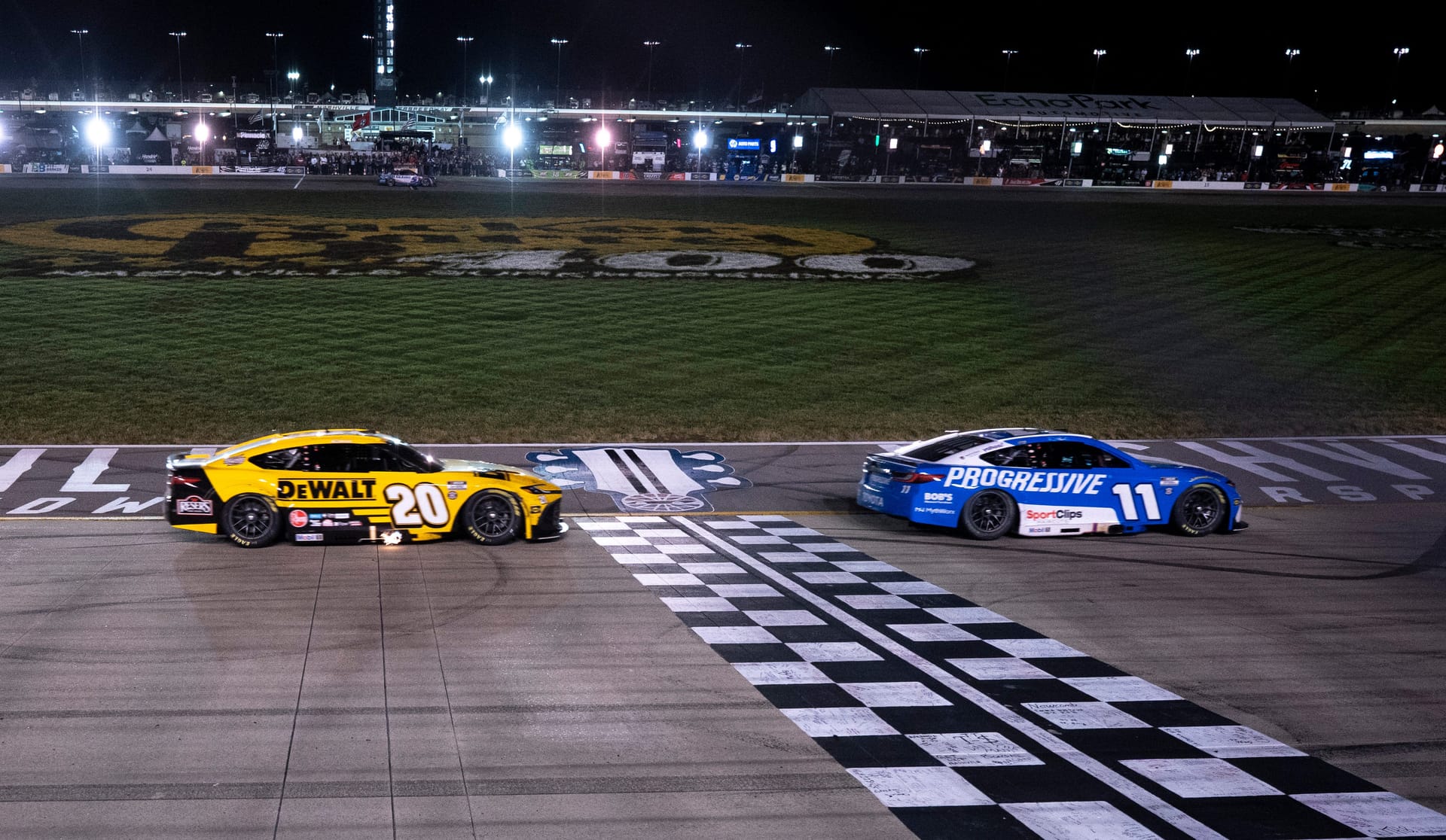 Denny Hamlin crosses the finish line ahead of Christopher Bell at the Nashville Superspeedway. - Source: Imagn