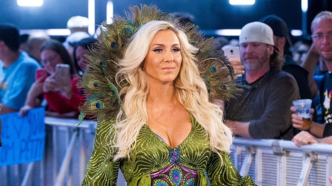 Charlotte Flair helped to the back by 9-time WWE champion after suffering injury on SmackDown