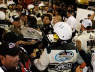 Crew members of Brad Keselowski and Denny Hamlin argue on Lowe's Motor Speedway. Source: Getty
