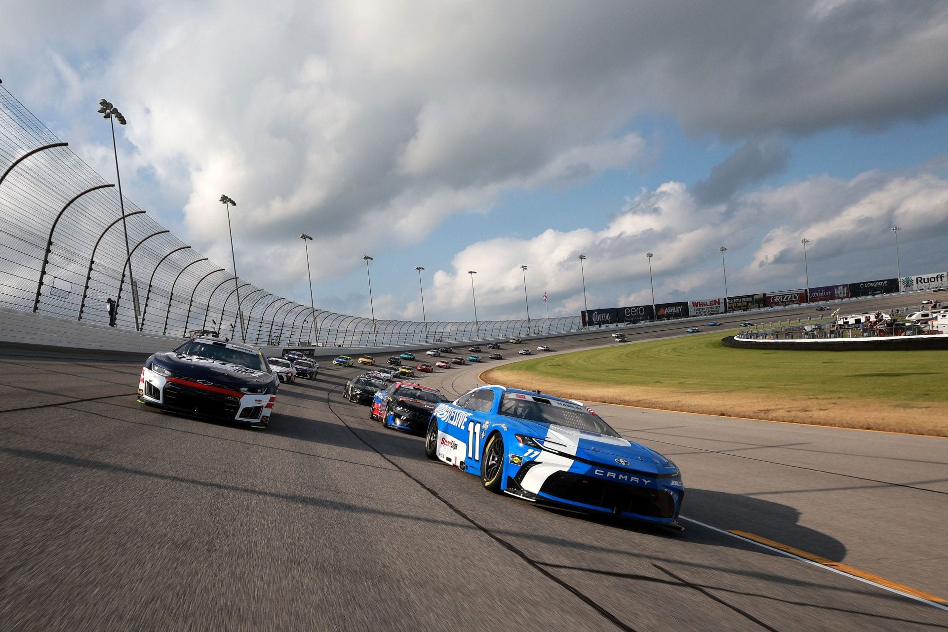 Denny Hamlin (11) and Kyle Larson (5) lead at Chicagoland Speedway. Source: Getty