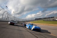 Denny Hamlin (11) and Kyle Larson (5) lead at Chicagoland Speedway. Source: Getty