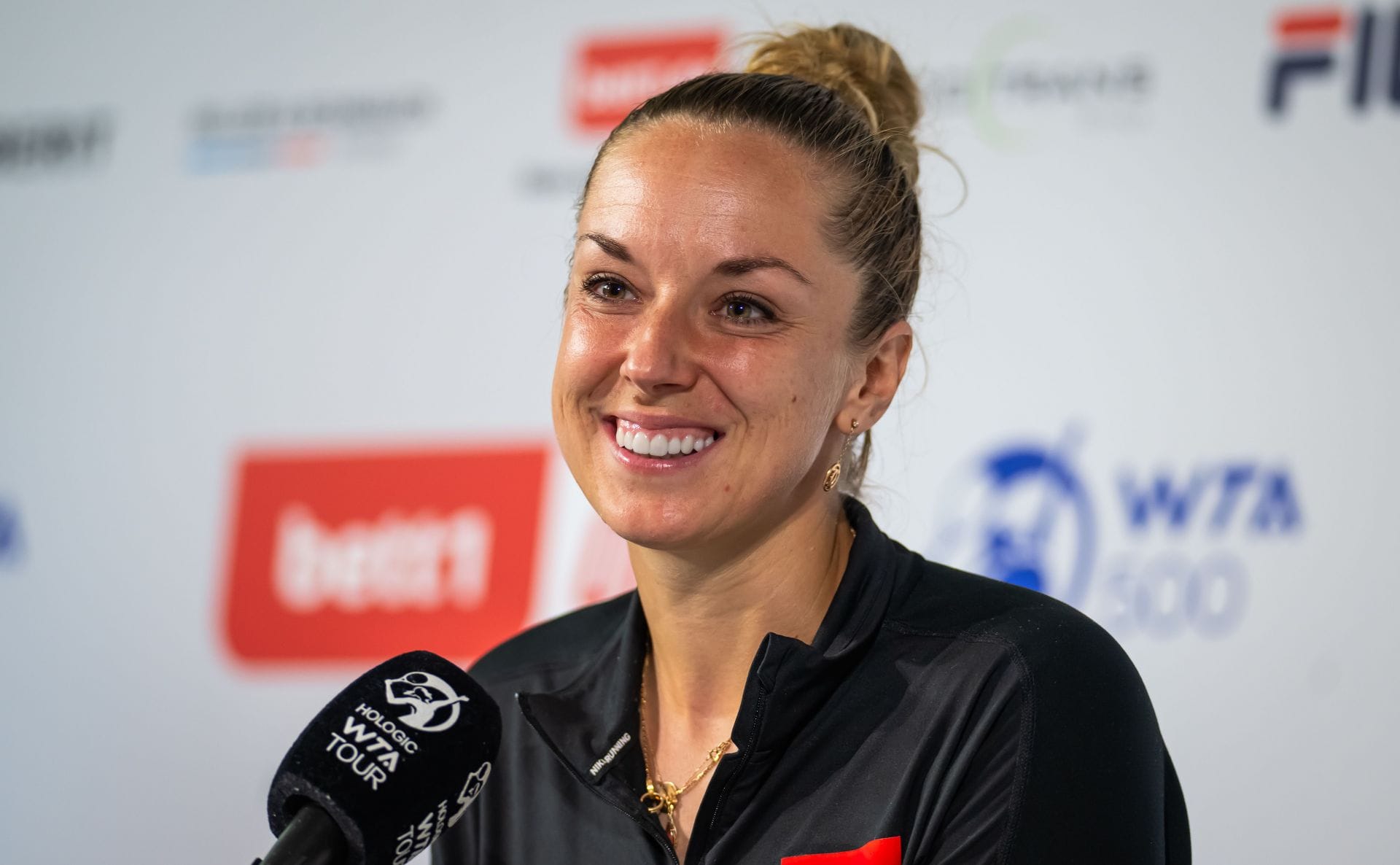 PICTURES: Sabine Lisicki poses in pink bikini as she enjoys pool plunge to beat the hot summer