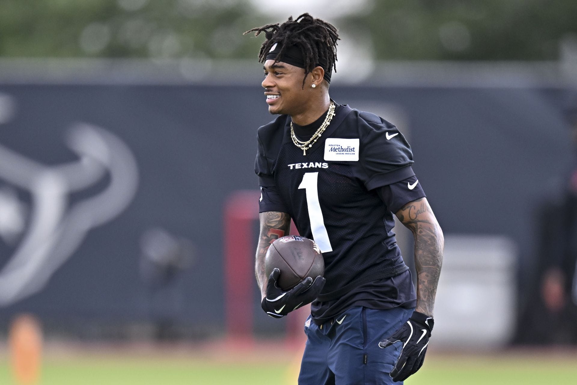 "Highly doubt he’s anywhere near the same player": NFL fans react as Tank Dell pulls off "a miracle" getting cleared for camp after gruesome injury