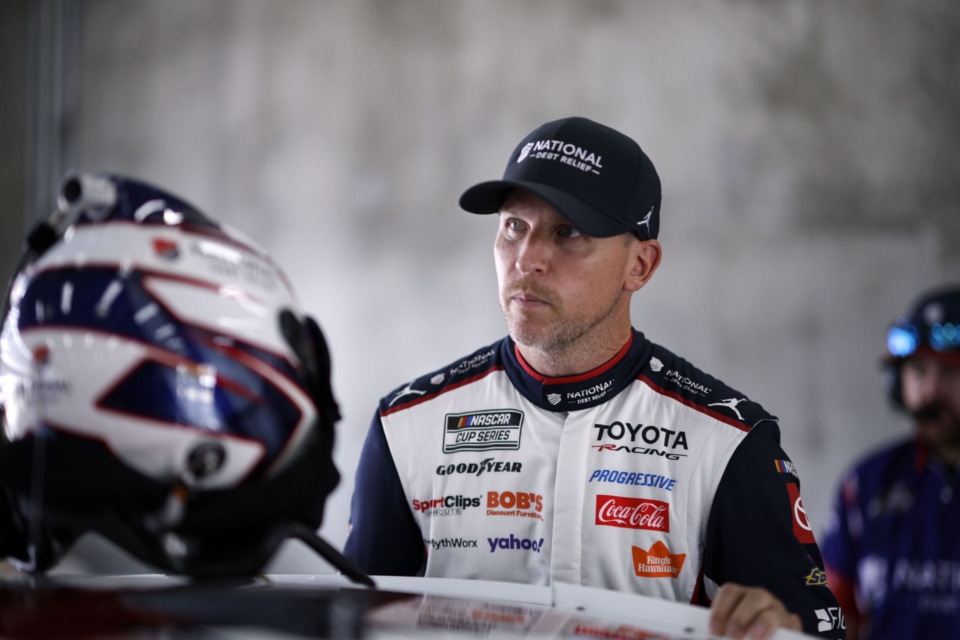 Denny Hamlin reacts as Richmond Raceway lists a "Hamlin family seat dedication" at the track