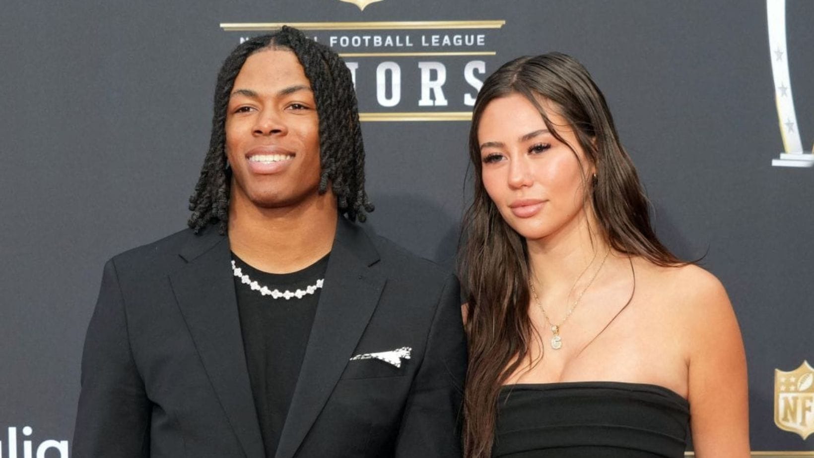 In Pics: Jahmyr Gibbs' gf Nicole shows off satin dress during fashion event at luxury estate in Bel Air