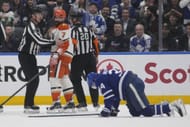 Radko Gudas (7) looks at an injured Matthews (34) - Source: Imagn