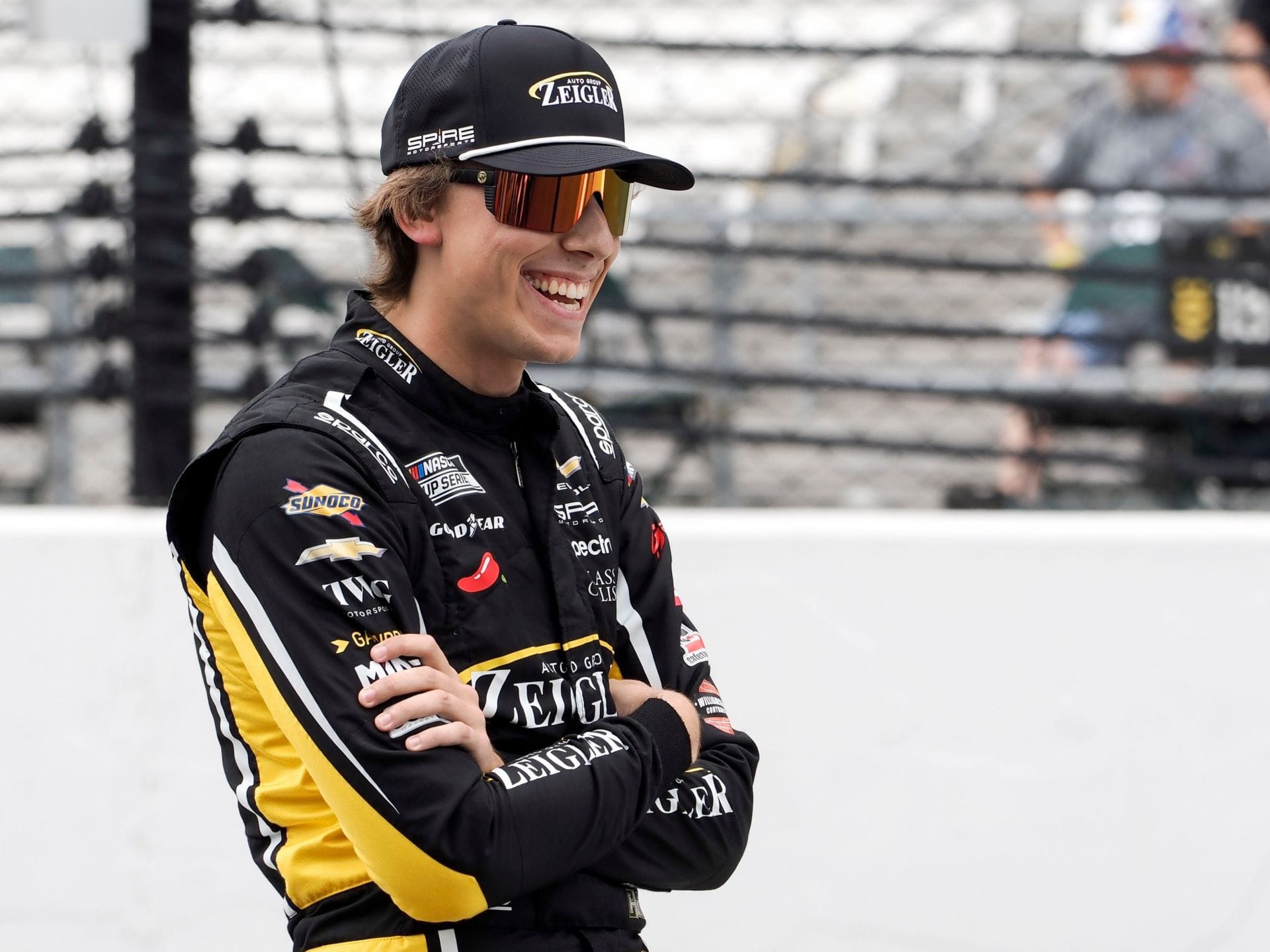 Carson Hocevar (77) on the pit wall during qualifying for the Brickyard 400. - Source: Imagn