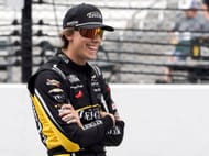 Carson Hocevar (77) on the pit wall during qualifying for the Brickyard 400. - Source: Imagn