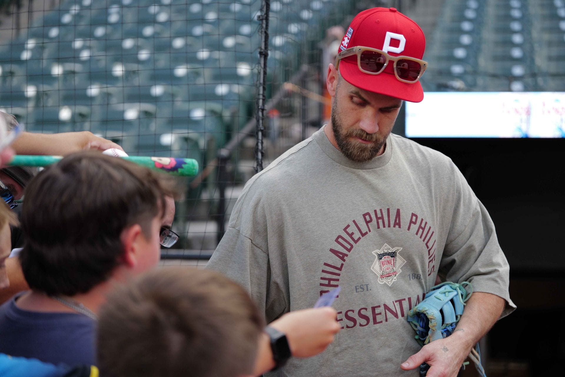 PICTURE: Bryce Harper's wife Kayla turns up glam in sleeveless black top and purple midi skirt at Morgan Wallen concert