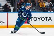 Pettersson skates with a puck during a game - Source: Imagn