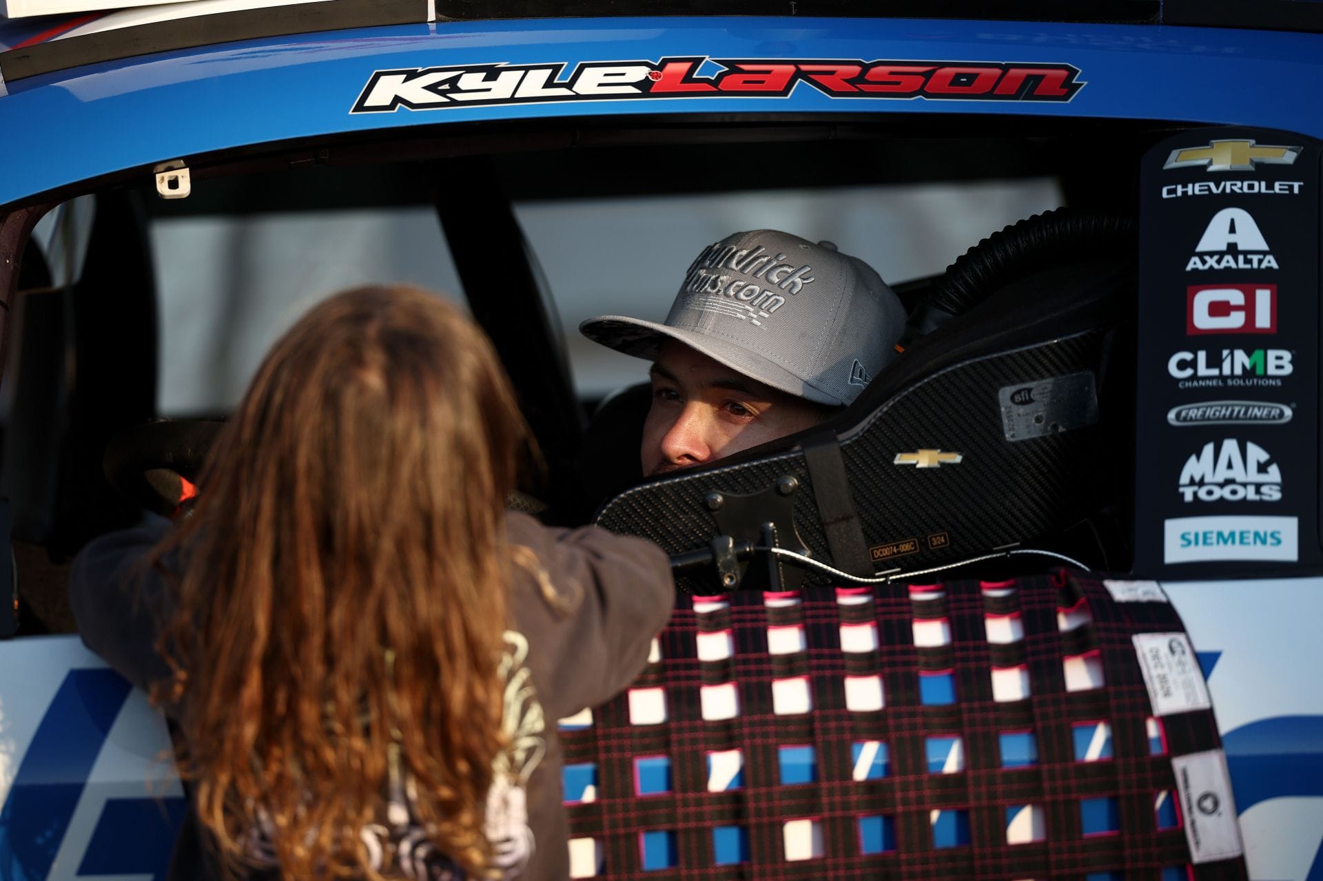 Kyle Larson with his daughter, Audrey Larson, at the Charlotte ROVAL. Source: Getty