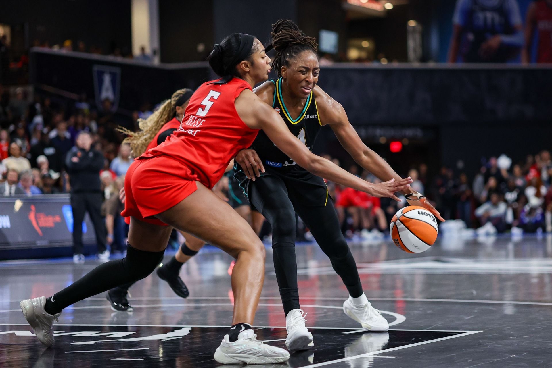 Angel Reese steals the ball from Nneka Ogwumike - Source: Imagn