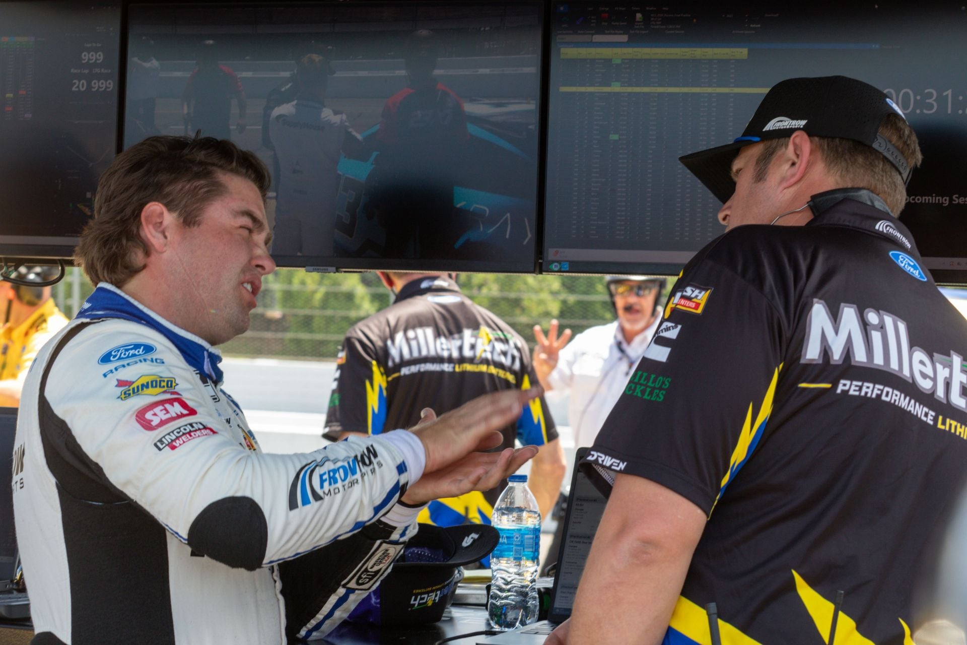 Noah Gragson with a Front Row Motorsports member at Pocono. Source: Getty