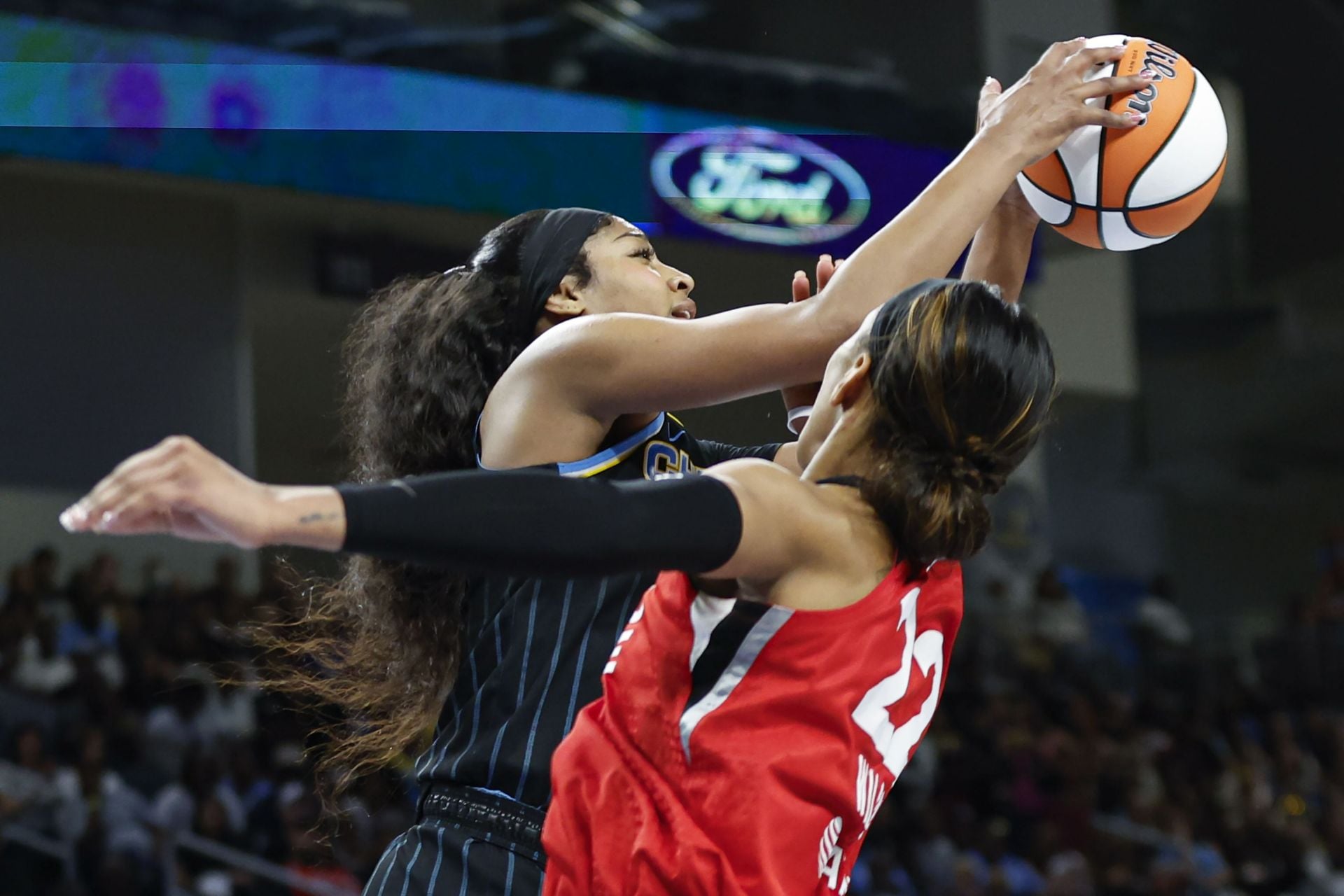 Angel Reese blocks A'ja Wilson - Source: Imagn