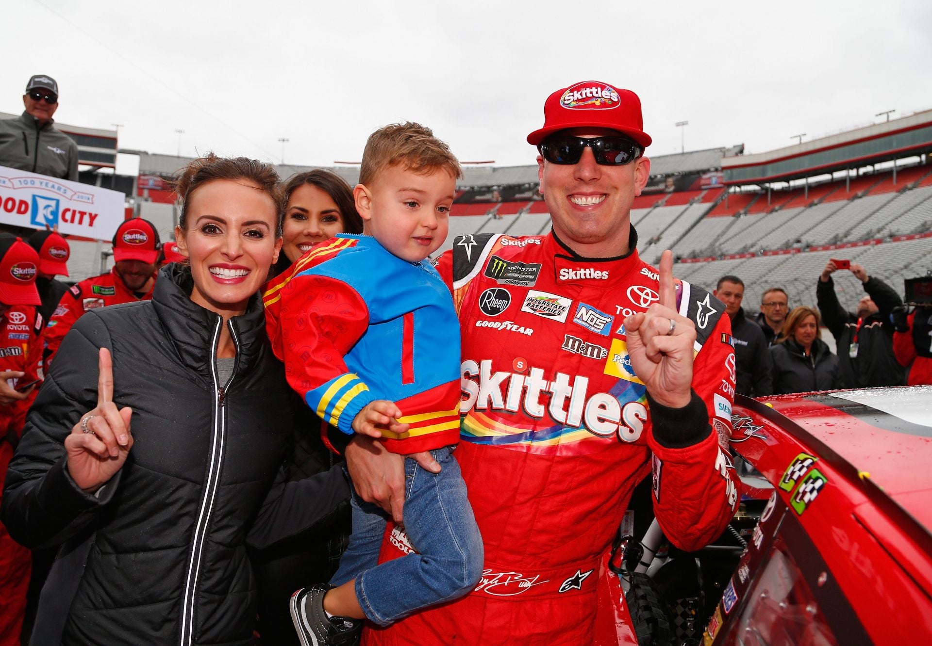 Kyle Busch, driver of the #18 Skittles Toyota, with Samantha and Brexton, after winning the NASCAR Cup Series Food City 500 at Bristol Motor Speedway on April 16, 2018. - Source: Getty