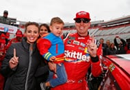 Kyle Busch, driver of the #18 Skittles Toyota, with Samantha and Brexton, after winning the NASCAR Cup Series Food City 500 at Bristol Motor Speedway on April 16, 2018. - Source: Getty