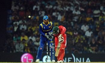 Zimbabwe cricketer Regis Chakabva (R) gets dismissed by Sri Lankan spinner Muttiah Muralitharan (unseen) as wicketkeeper Kumar Sangakkara (L) watches 