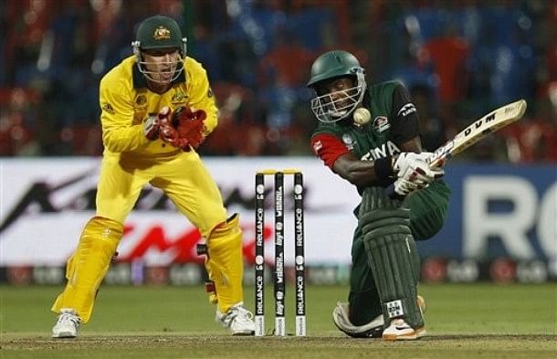 Kenya&#039;s cricketer Collins Obuya, right, attempts a shot as Australia&#039;s Brad Haddin, left, reacts during the Cricket World Cup Group A match between Australia and Kenya in Bangalore, India, Sunday, March 13, 2011.