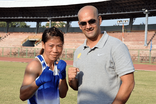 M.C. Mary Kom, supported by Olympic Gold Quest, with OGQ CEO Viren Rasquinha after the fight.