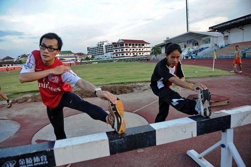 Laotion athletes Kilakone Siphonexay (L) and Lealy Phoukhavont during a training session in Vientiane