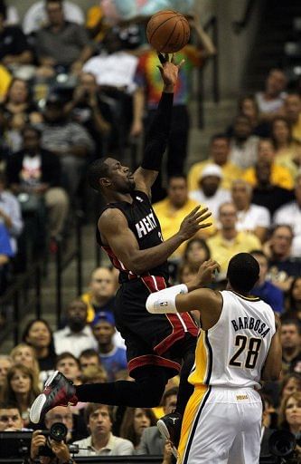 Dwyane Wade (L) on Sunday had nine rebounds and six assists for the Heat