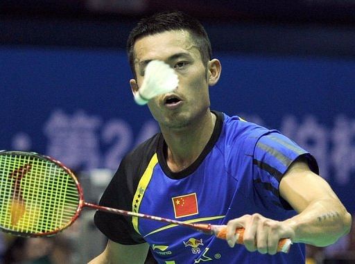 Lin Dan of China returns a shuttlecock