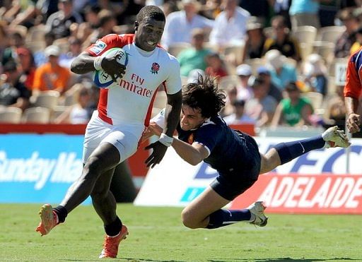 Christian Wade (left) is tackled by France&#039;s Paul Albaladejo