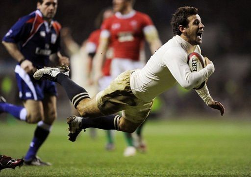 Danny Care (right) dives over to score a try against Wales during the RBS Six Nations International rugby union match