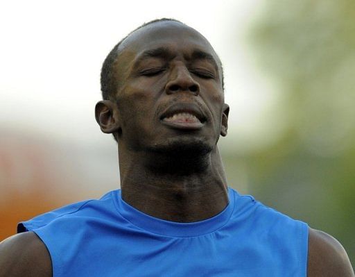 Usain Bolt grimaces after staggering to victory in 10.04 seconds