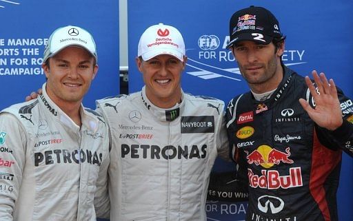 Michael Schumacher (centre) is flanked by Nico Rosberg (left) and Mark Webber after the qualifying session