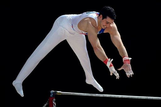 British Kristian Thomas competes on the horizontal bar