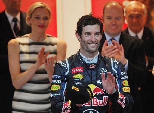 Red Bull driver Mark Webber (centre) celebrates on the podium after winning the Monaco Grand Prix