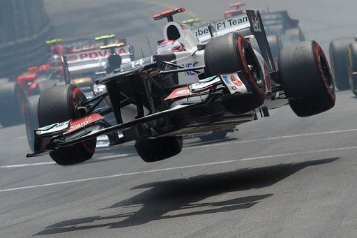 Sauber&#039;s Kamui Kobayashi is sent airborne after crashing at the Monaco Grand Prix